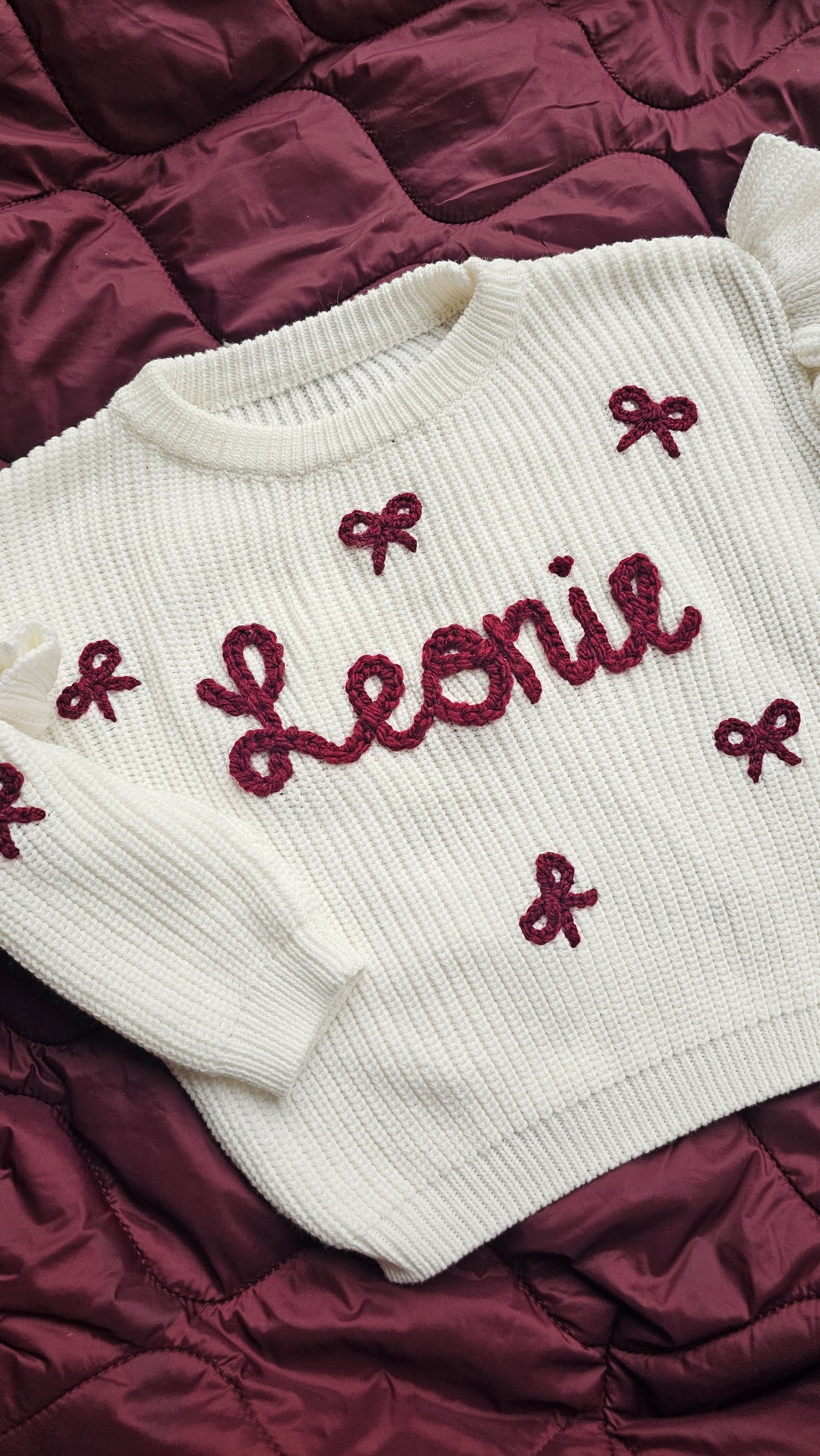 Sweater met naam en  strikjes