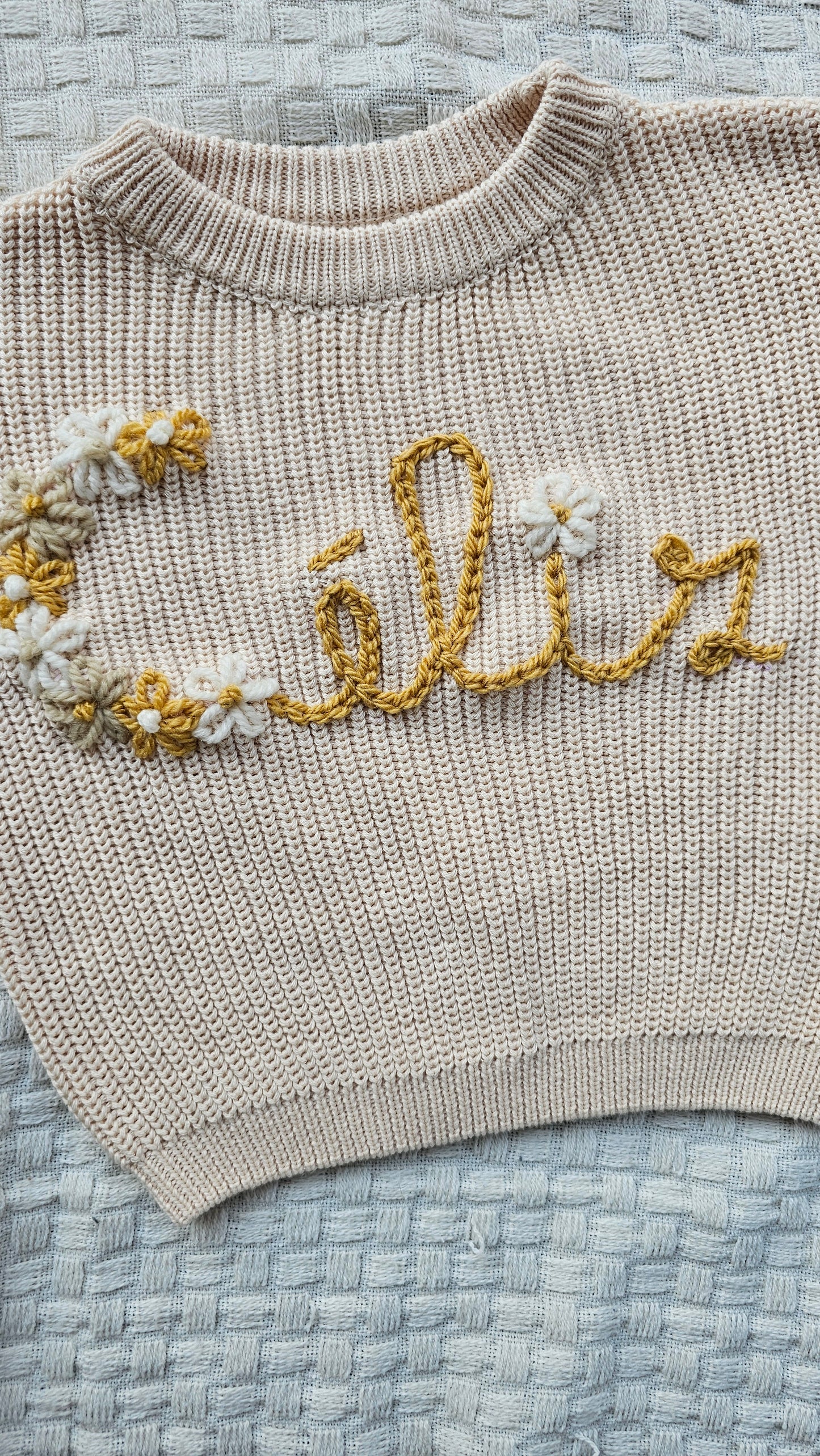 Sweater bloemenletter + naam