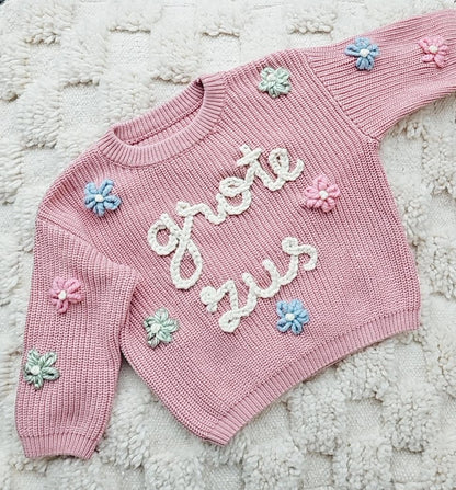 Sweater met naam en bloemen (max. 7 stuks)
