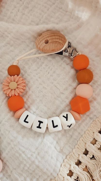 Speenkoord met naam bloem peach/oranje